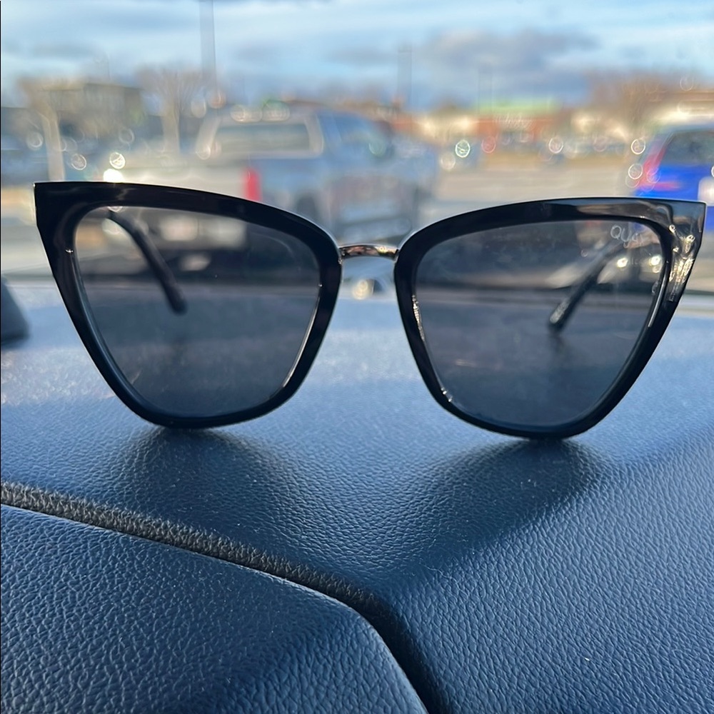 Black Cat-Eye Sunglasses with Metallic Frame and Dark Lenses